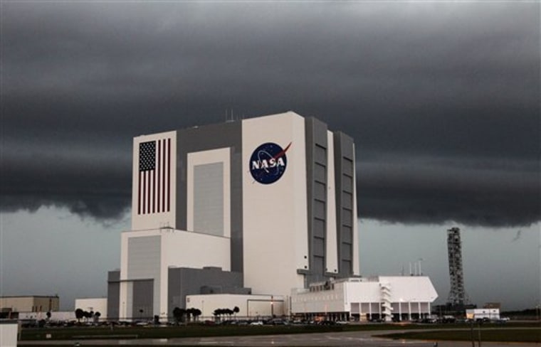 The Vehicle Assembly building is shown as storm clouds pass through at Kennedy Space Center in Cape Canaveral, Fla. on Thursday, March 31, 2011. The crew for the space shuttle Endeavour had to skip some of their practice countdown drills Thursday morning while the space center was under a tornado watch. (AP Photo/Terry Renna)